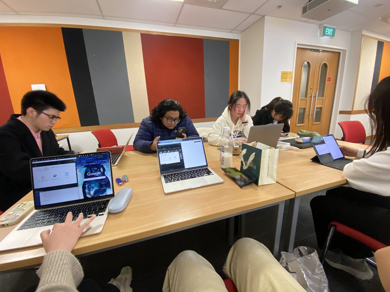 Team preparing cases on laptops